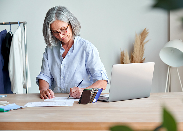 Middle aged female virtual assistant at desk