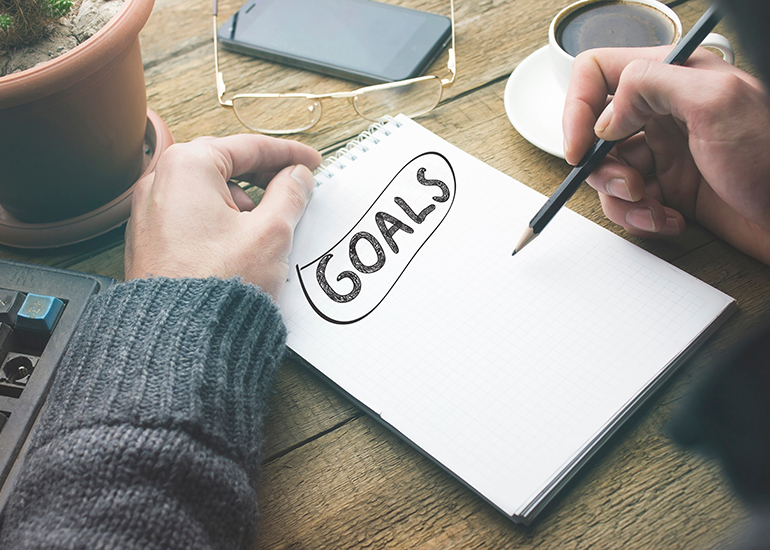 Writing goals on notepad