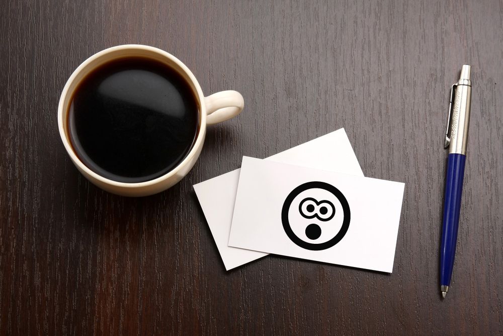 business card and coffee cup