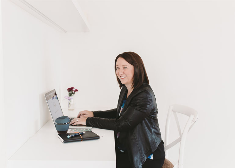 Kerri Bennett at work in her business, Yellow Door Digital
