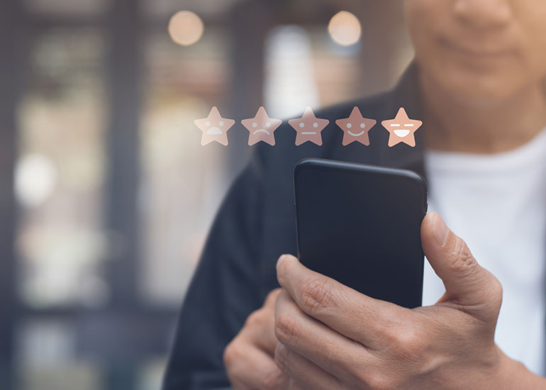 Man using mobile to leave 5 star rating - interactive content