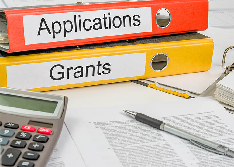 Colourful folders labelled 'Grants' and 'Applications'
