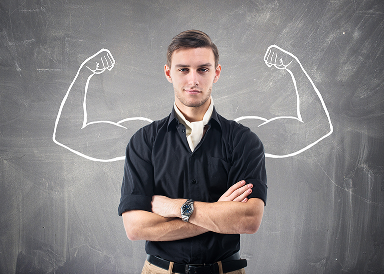 Strong independent young man with arms crossed
