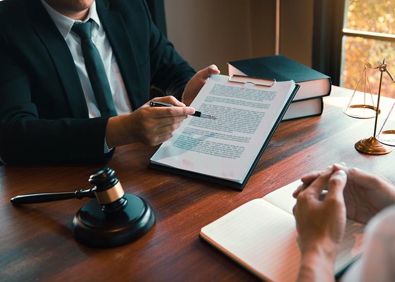 Lawyer showing legal document to client