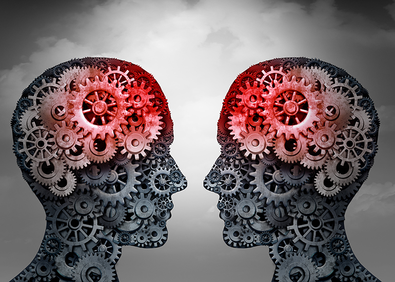 Silhouette heads in profile filled with cogs