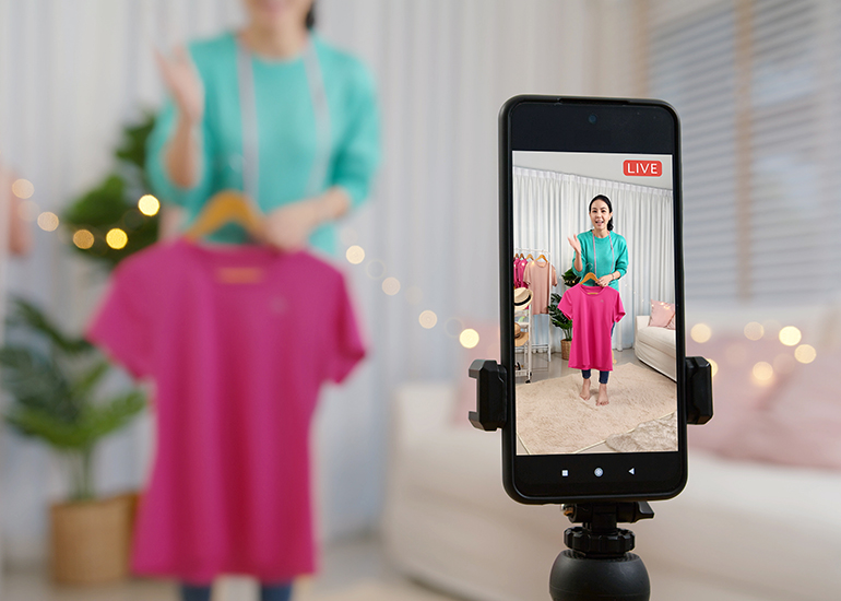 Woman creating TikTok social media video