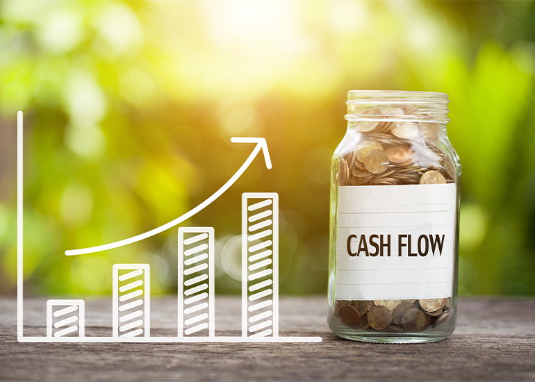 Jar filled with coins labelled 'cash flow'