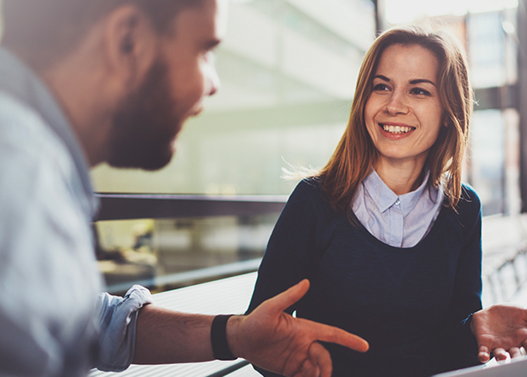Two young co-workers in meeting