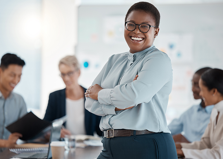 happy confident business woman in office