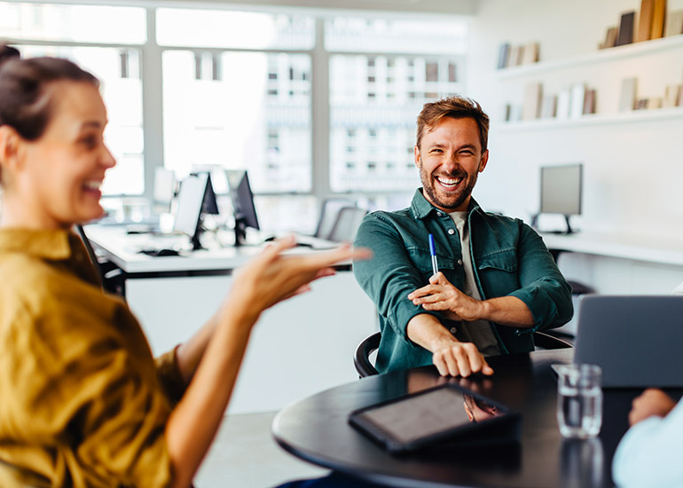 happy team laughing in office