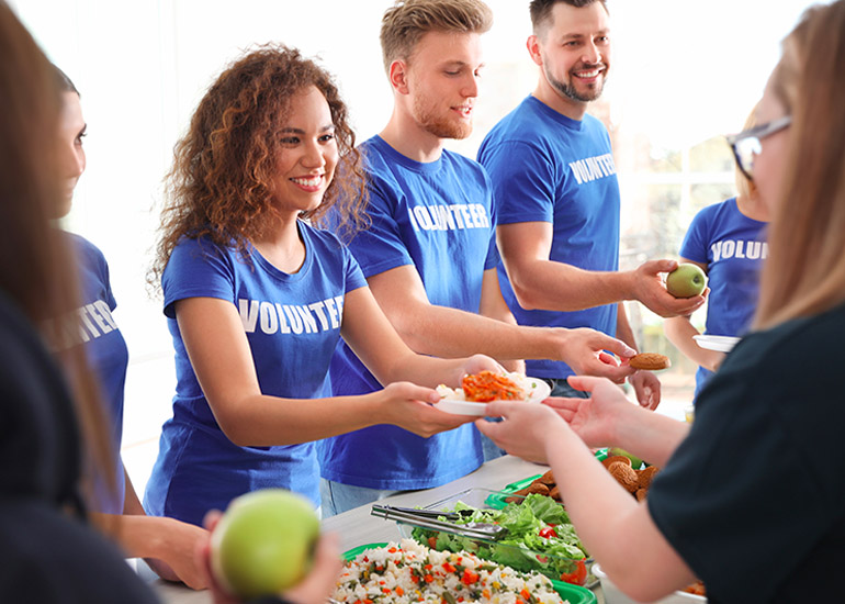 volunteers serving food