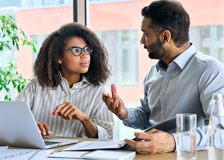 Male and female colleague in conversation