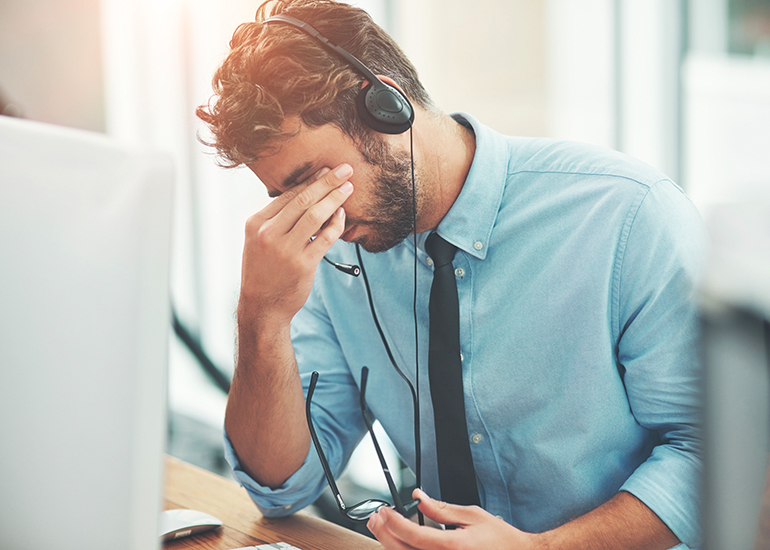 stressed man on phone call