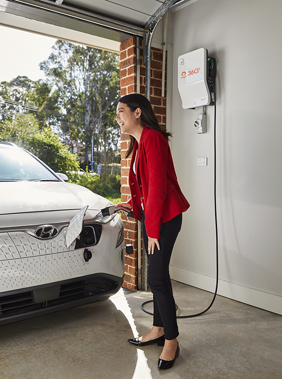 Chau Le with the Origin Energy charging station