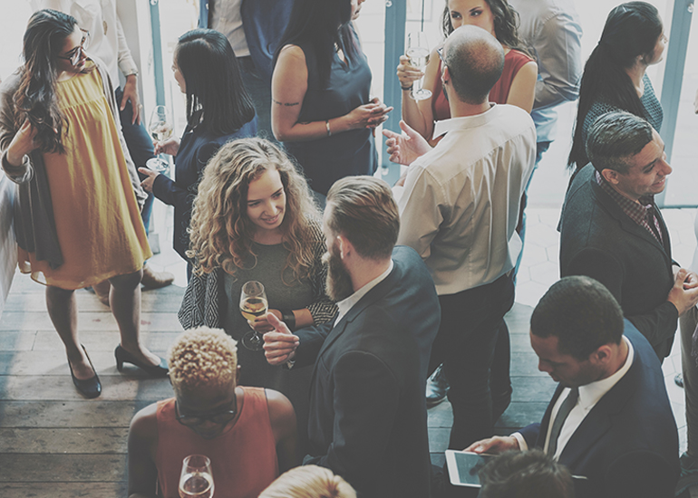 Large group of people at indoor networking event