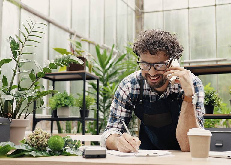 Plant nursery owner making phone call