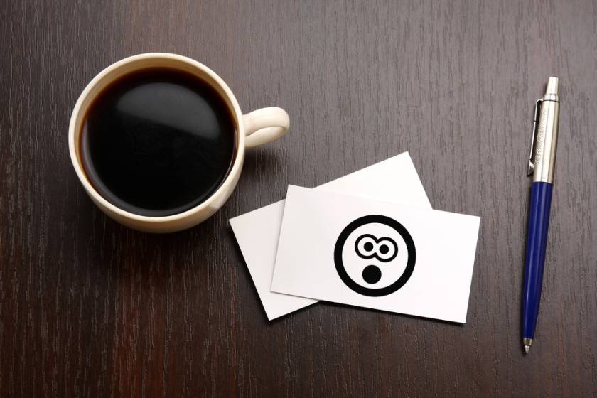 business card and coffee cup