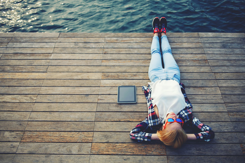 Relaxing on a pier by the water
