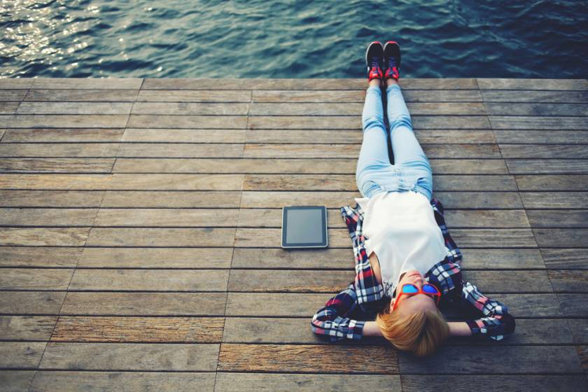 Relaxing on a pier by the water
