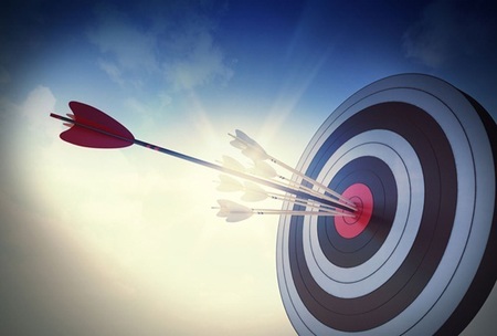 arrow hitting bullseye on target