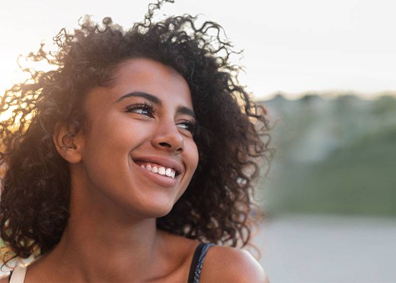 smile if you want to feel more optimistic