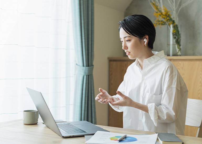 woman looking at computer screen - sole trader