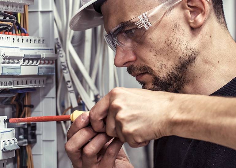 Electrician working at trade