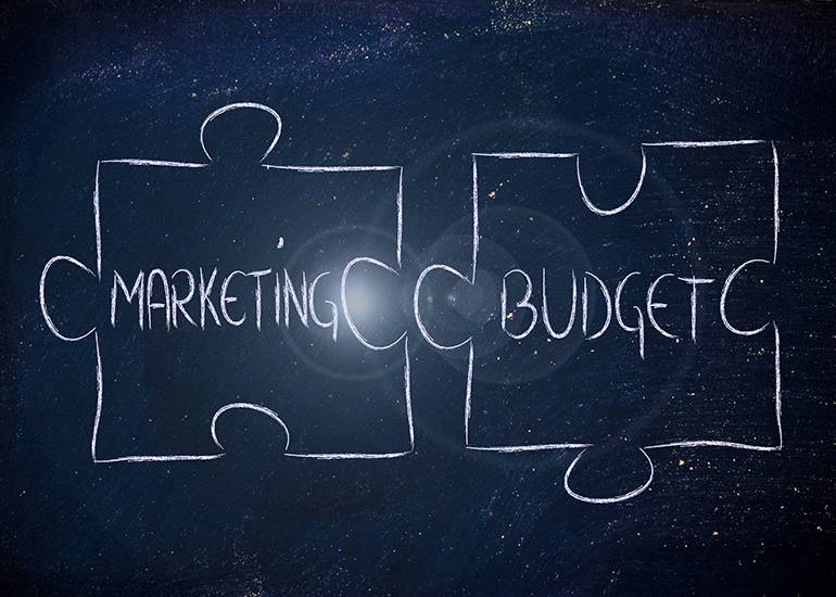 Puzzle pieces with the words ‘marketing’ and ‘budget’