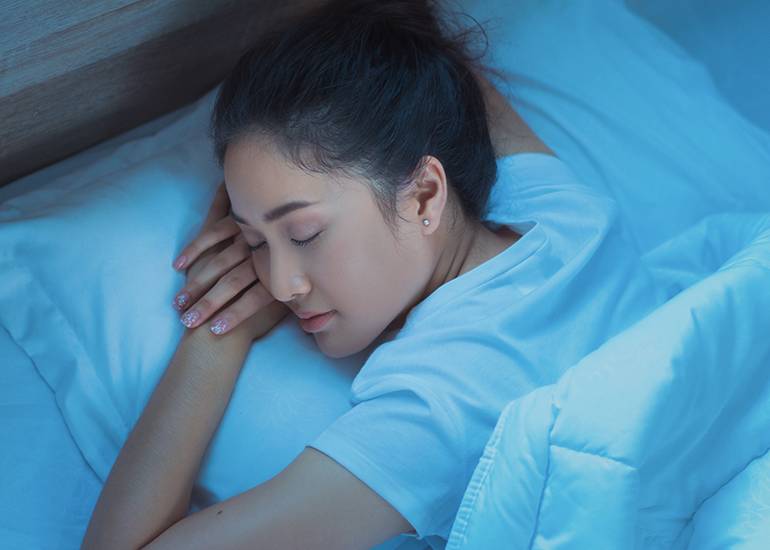 Peacefully sleeping woman getting a good night’s sleep