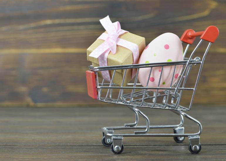 Easter egg and gift in shopping trolley