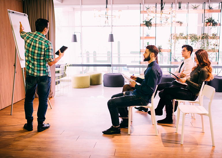 Business man pitching business idea to investors