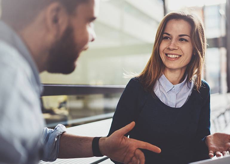 Two young co-workers in meeting