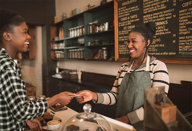 happy customer paying with card