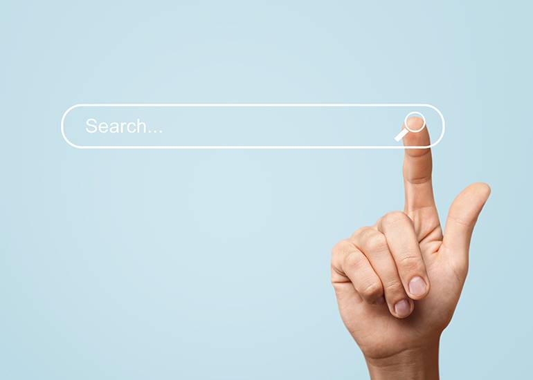 Hand clicking search pane on screen