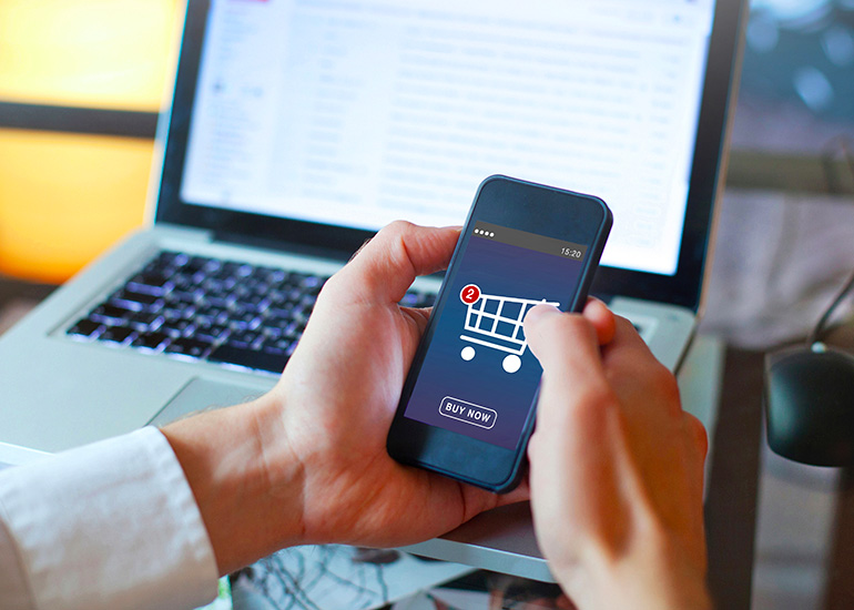 Man using phone to shop online