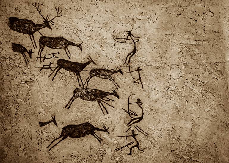 Ancient cave paintings depicting hunting or battle