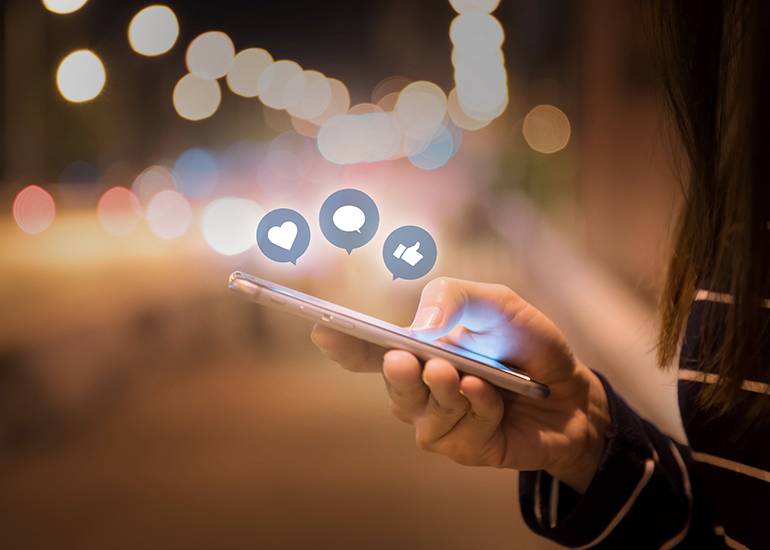 Person using smartphone to use social media, Facebook, Instagram, Youtube