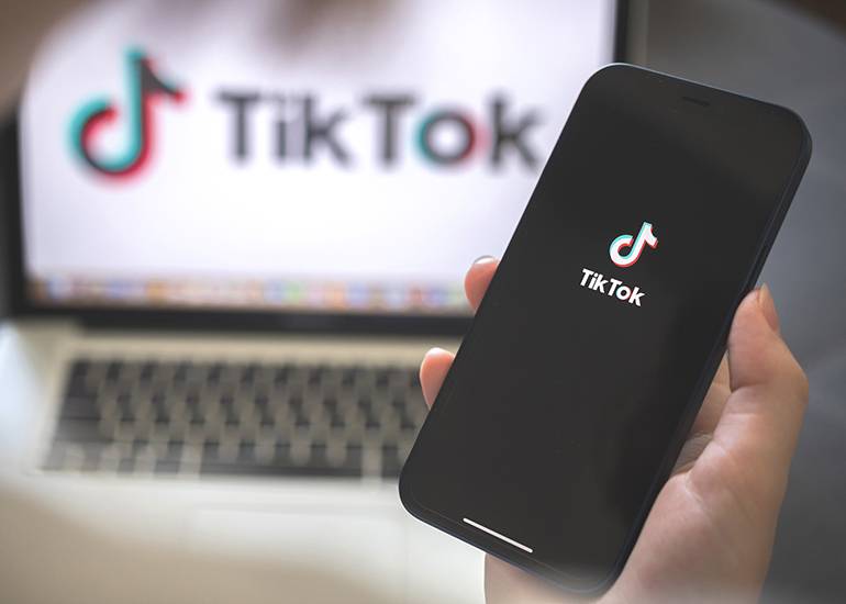 TikTok app on computer and phone