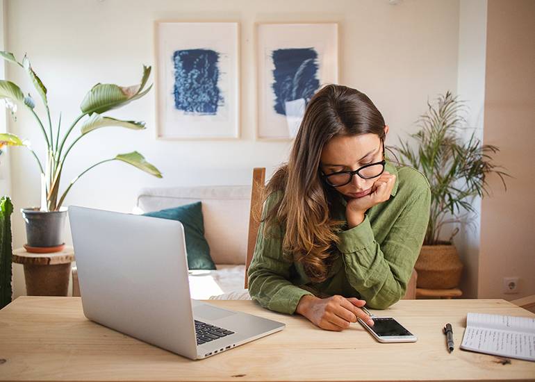 woman procrastinating on phone