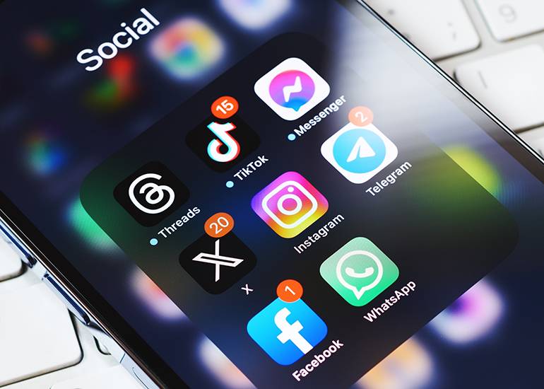 Social media icons on mobile phone screen