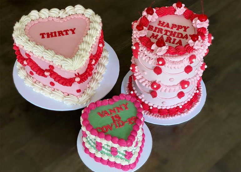 A selection of birthday cakes with strawberry buttercream created by Olivia .