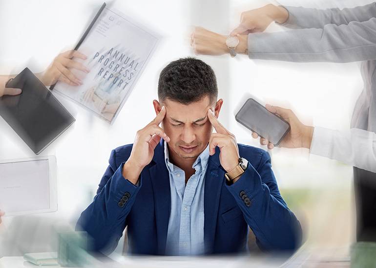 Overwhelmed businessman feeling exhaustion or burnout