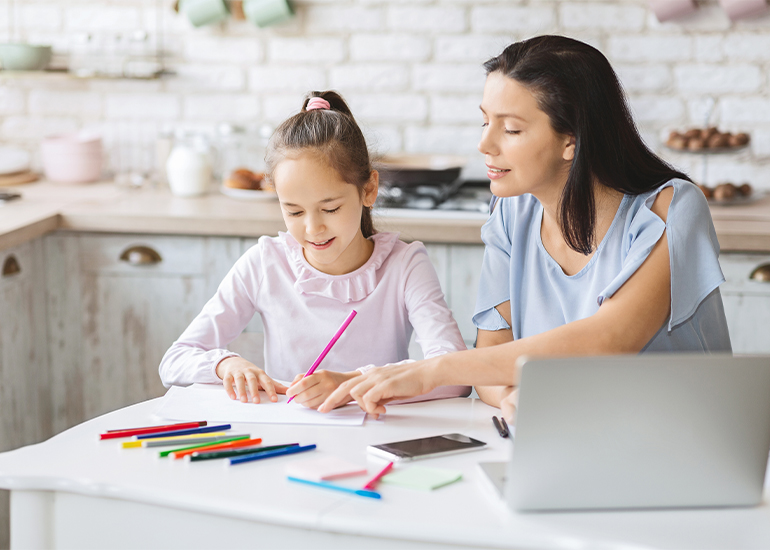 Mum helping daughter with homework