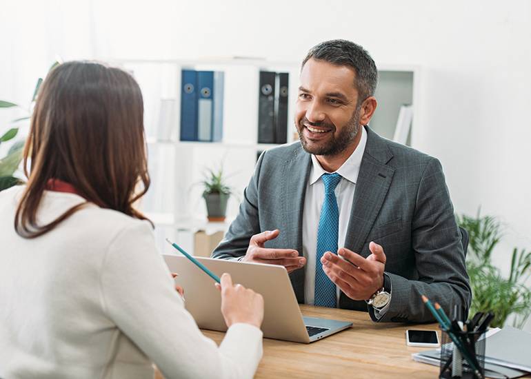 Man and woman having meeting in office