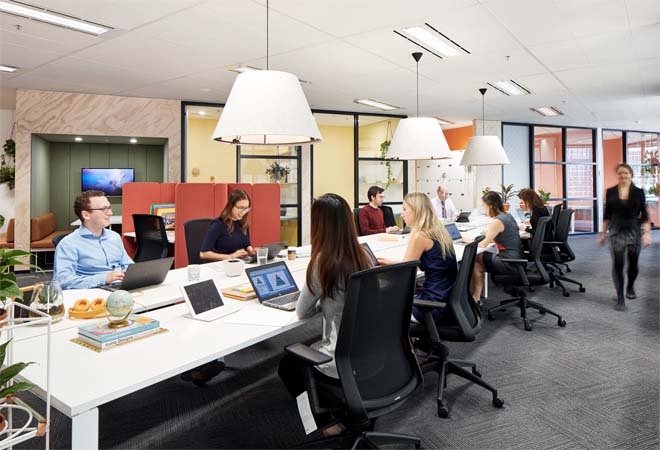 Long desk co-working space in office