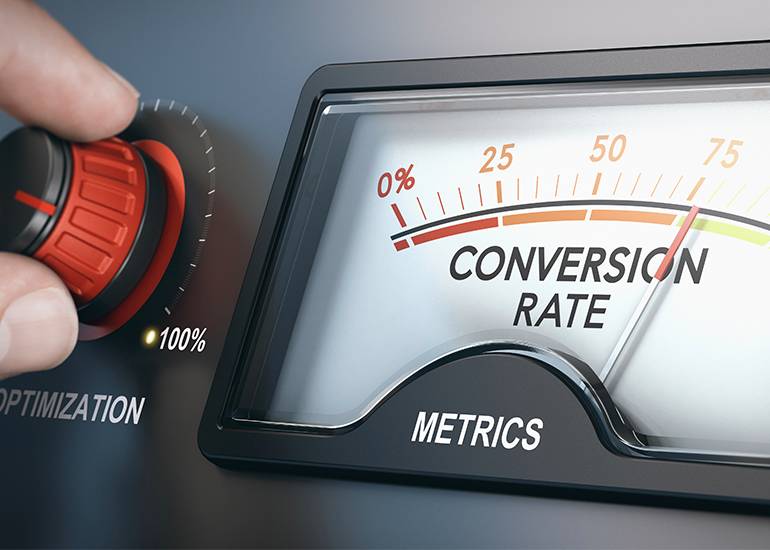 conversion rate hand turns a dial up on a meter reading conversion rate.