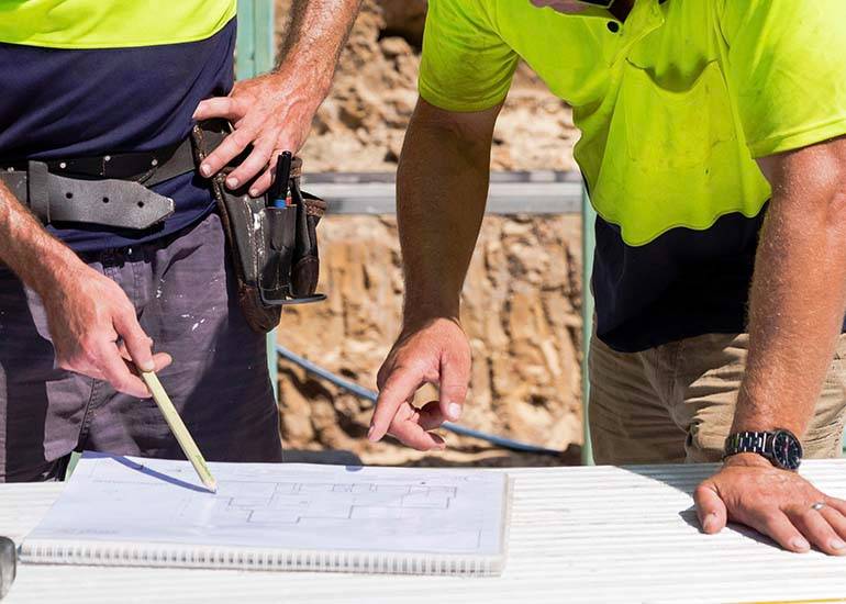 tradie looking at paperwork