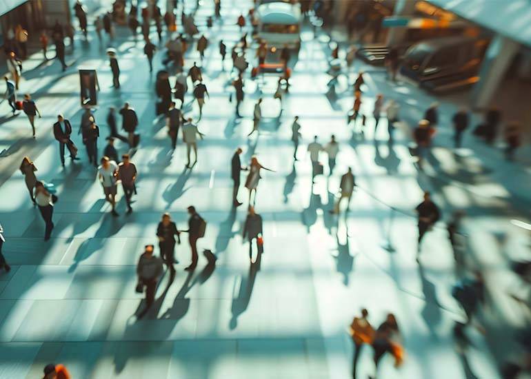 hustle culture- busy life- a street teeming with people moving in a rush