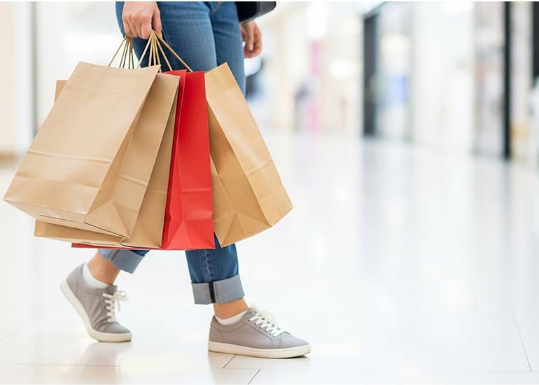 person carrying shopping bags